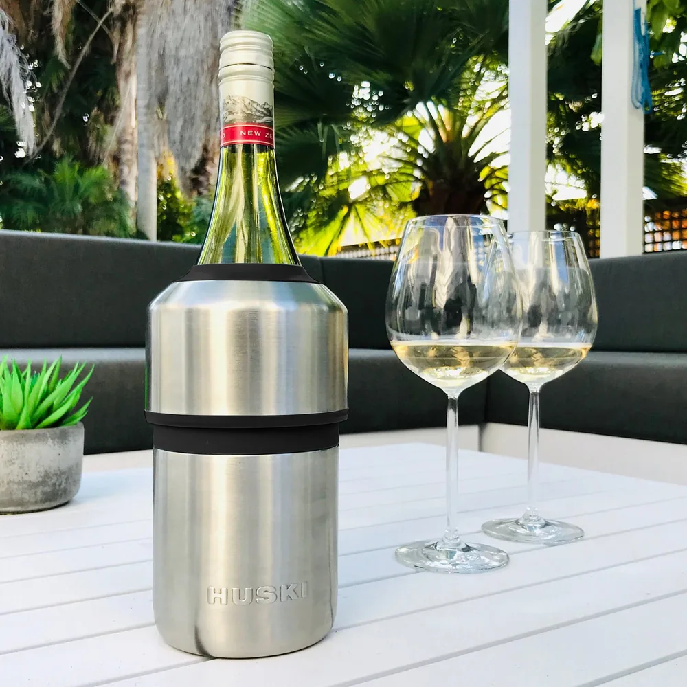 Huski Wine Cooler with a bottle of white wine on an outdoor table